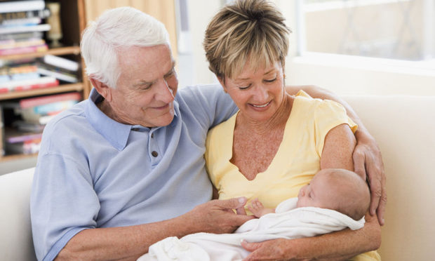 bigstock-grandparents-in-living-room-wi-4135705